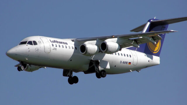 Lufthansa Avro RJ85 regional jet with four engines on approach to London Heathrow Airport.
